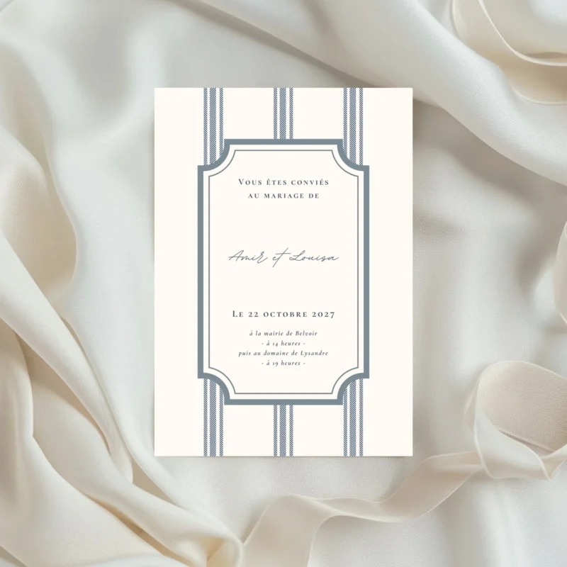 Faire-part de mariage au style classique, avec cadre graphique et fines rayures verticales, présenté au format portrait.
