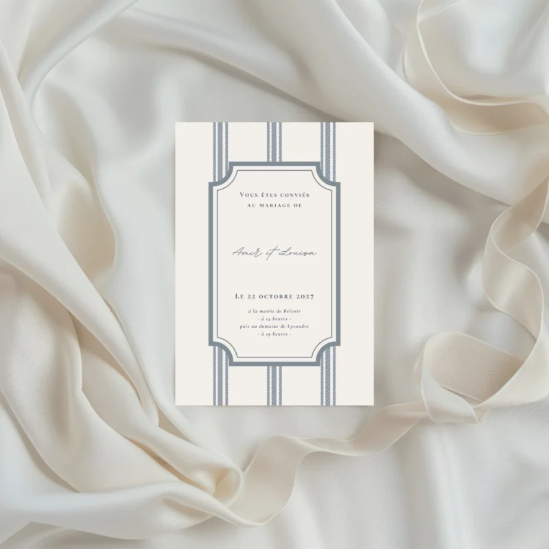 Faire-part de mariage au style classique, avec cadre graphique et fines rayures verticales, présenté au format portrait.
